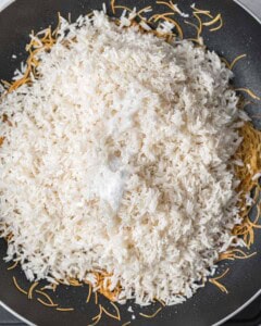 rice and salt added over Vermicelli in pan.