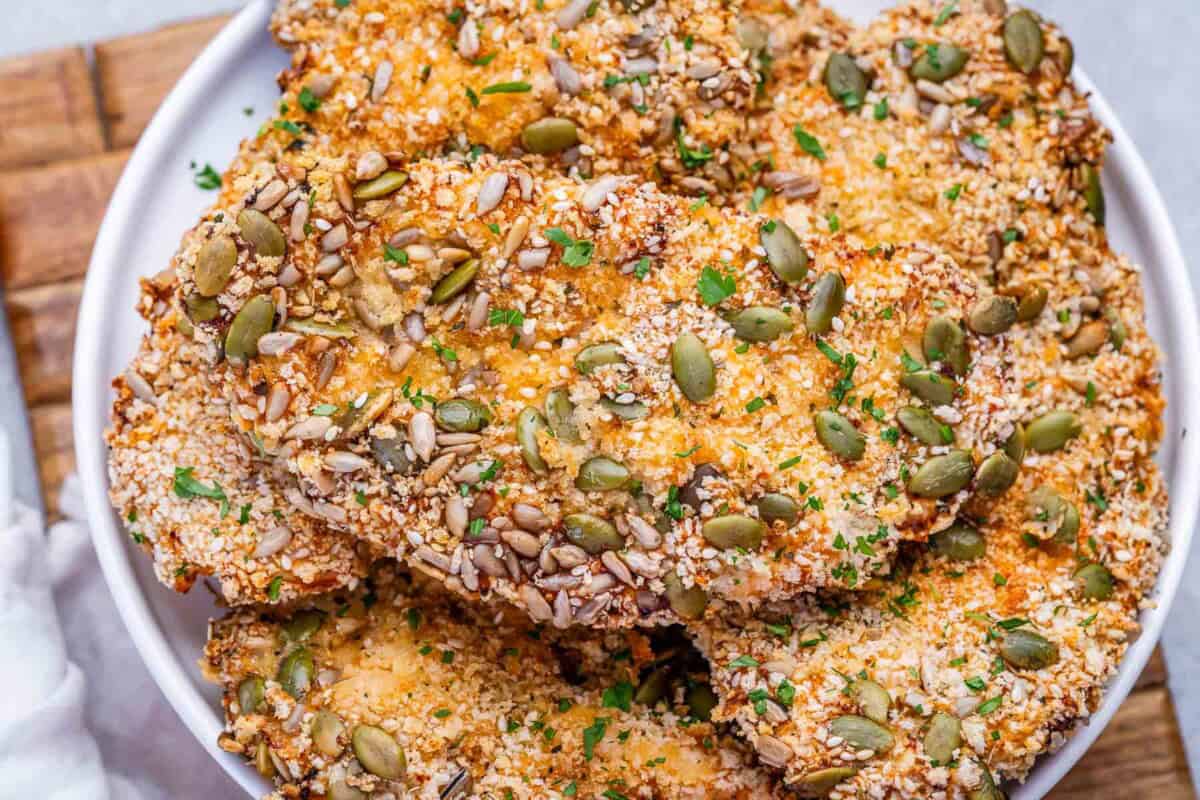 air fried breaded chicken cutlets served over a plate.