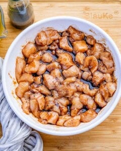 marinating chicken in a bowl.