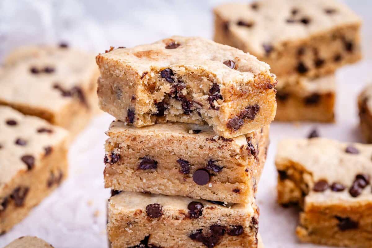 cookie bar stacked over each other on a parchment paper.