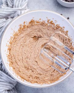 oil, butter, and sugar whipped in a bowl.