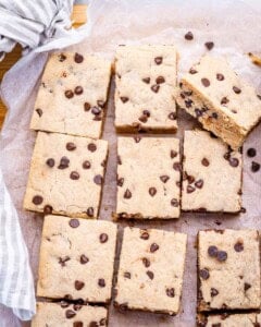 cookie bars being cooled on a flat surface.
