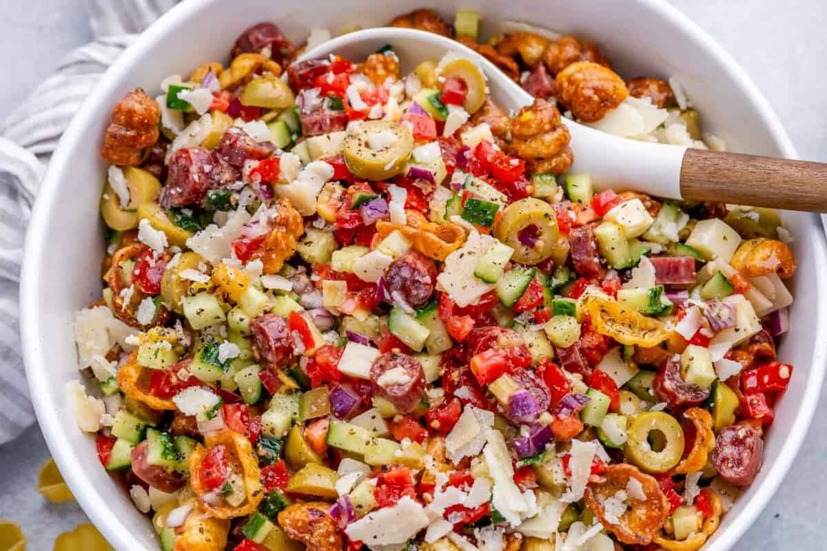 crispy pasta salad in a bowl with a spoon in it.
