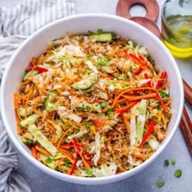 a bowl of crispy rice salad with veggies.