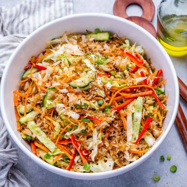 a bowl of crispy rice salad with veggies.