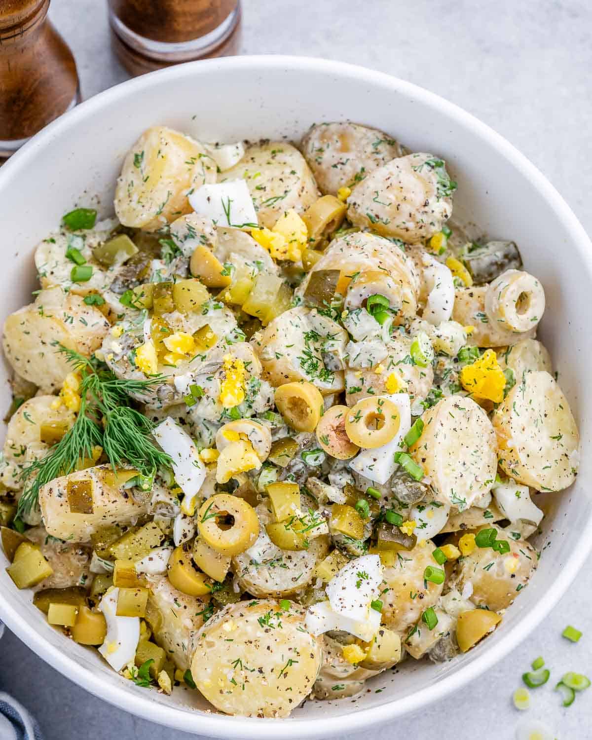 potato salad with pickles in a bowl.