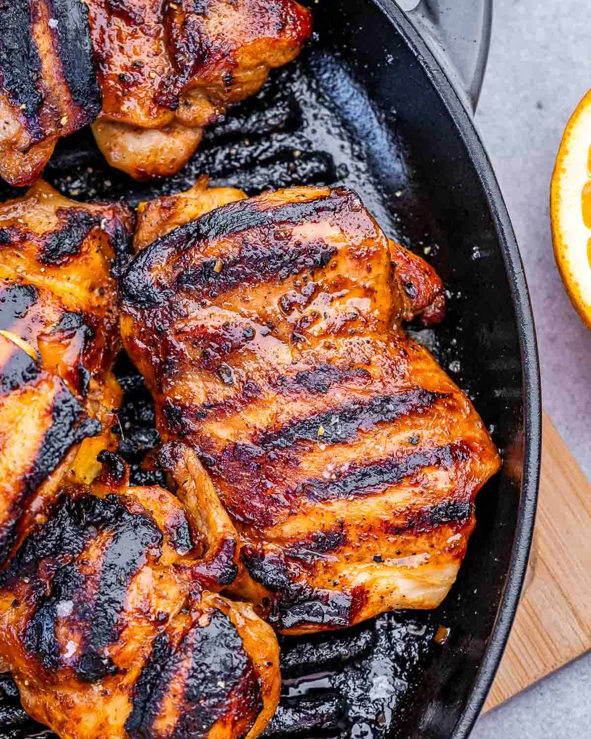 grilled chicken thighs on a grill pan.