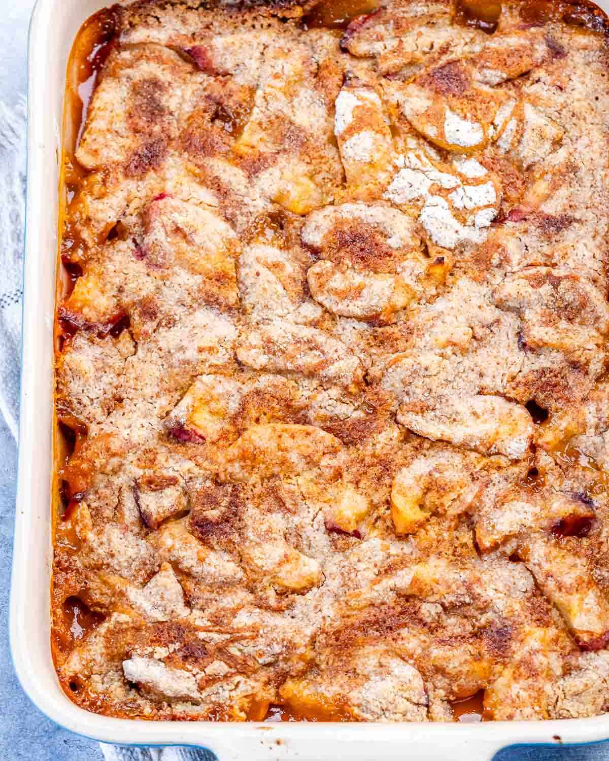 A baking dish with peach dump cake
