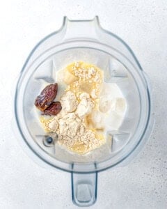 ingredients for the protein shake added to the blender.