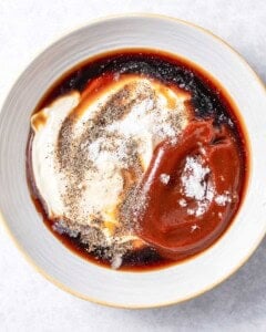 ingredients for canes sauce placed in a bowl.