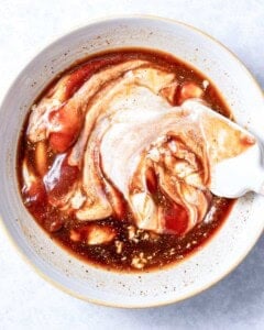 mixing the ingredients for canes sauce.