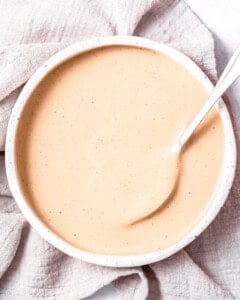 spoon a bowl with canes sauce.