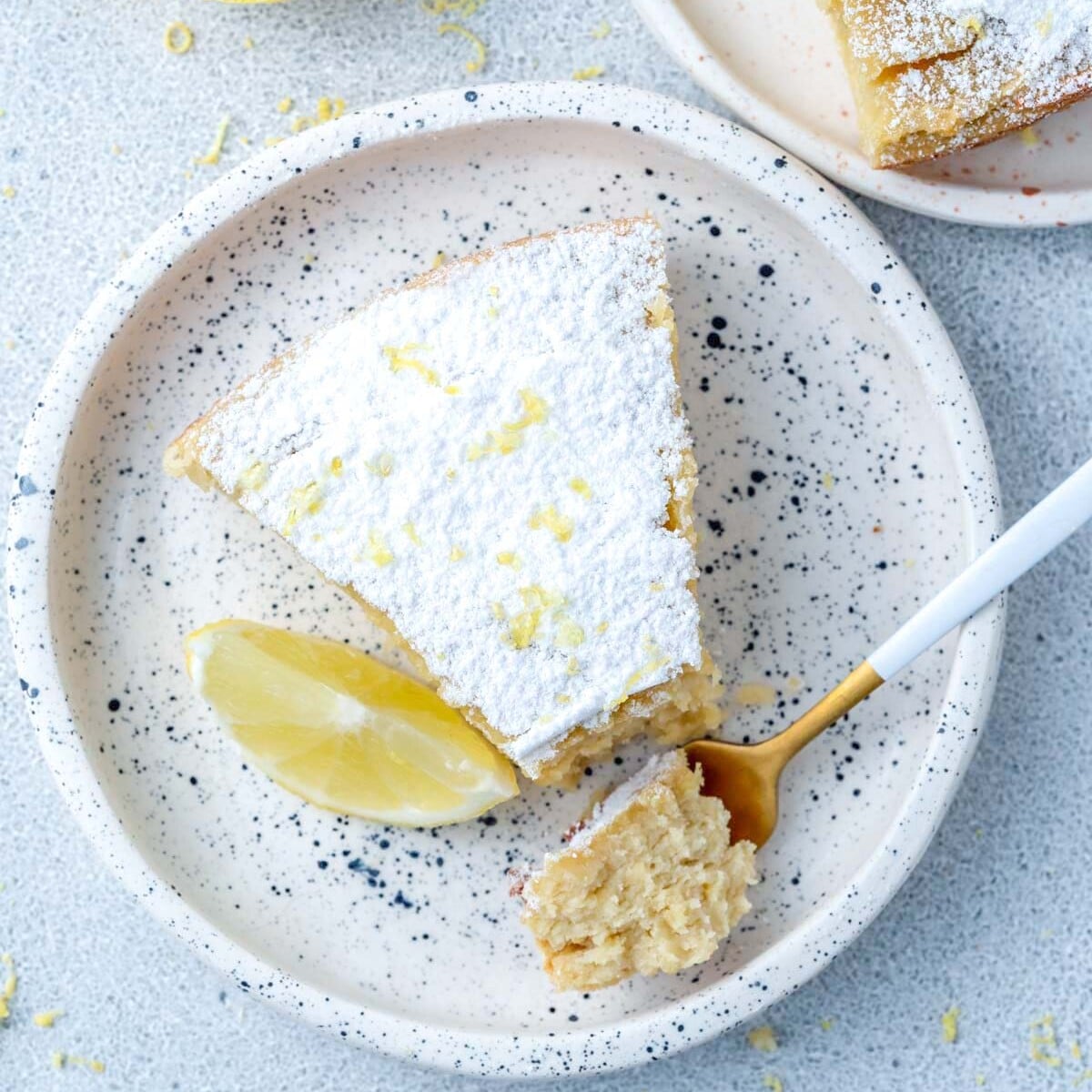 a slice of lemon cake on a plate.