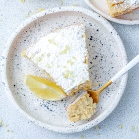 a slice of lemon olive oil cake on a plate.