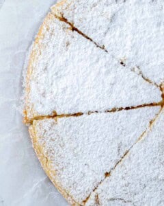 lemon cake sliced and topped with powdered sugar.