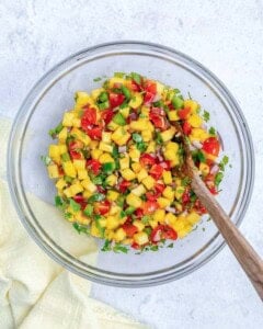 mixed mango pico de gallo in a bowl.