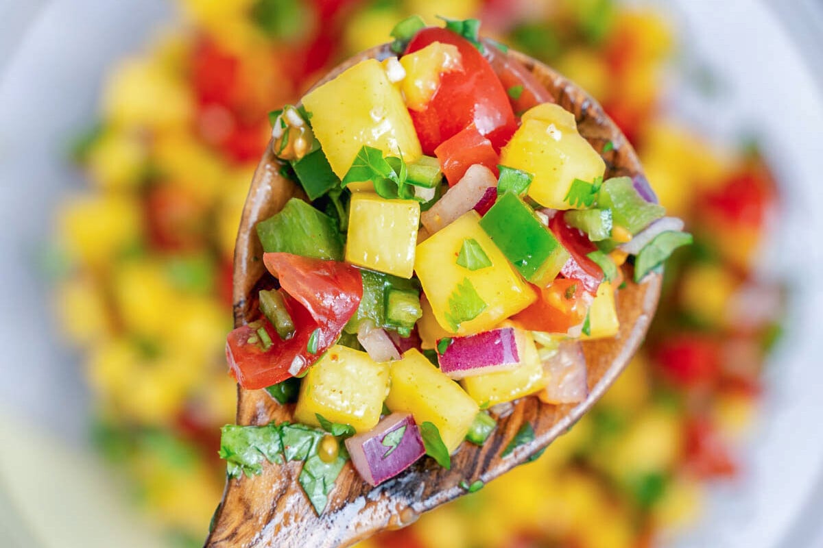 a spoonful of mango pico de gallo.