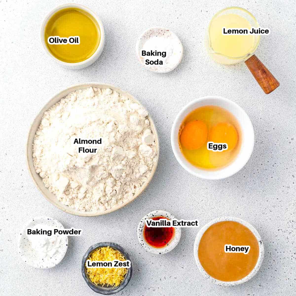 ingredients to make lemon cake with olive oil and almond flour.