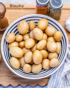 cleaning baby potatoes to be air fried.