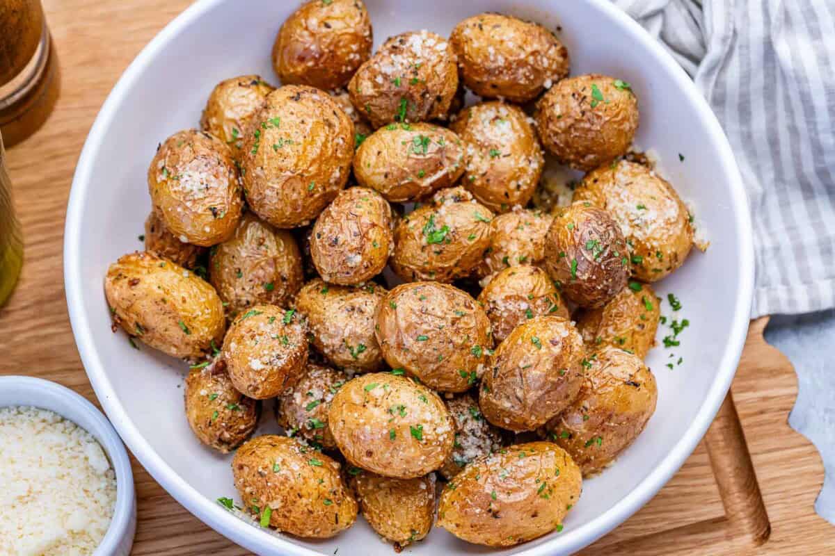 Air-fried potatoes in a round white bowl.