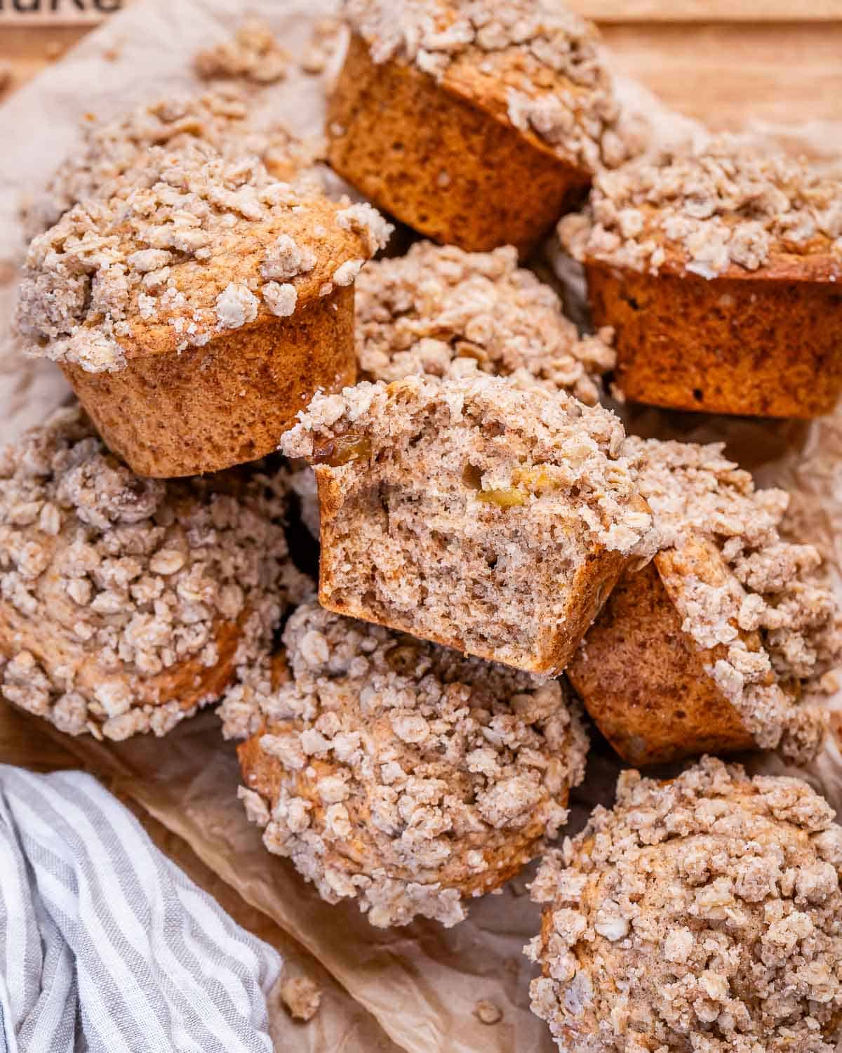 cinnamon Streusel muffins packed over each other on a dish.