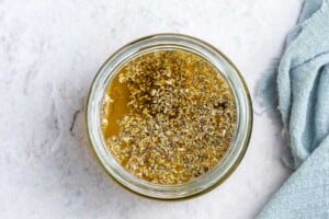 salad dressing ingredients placed in a jar.