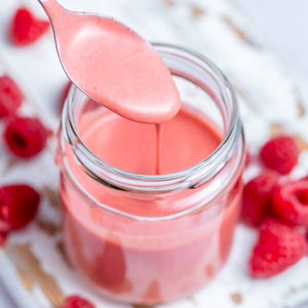 a jar filled with raspberry Vinaigrette dressing.