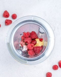raspberry vinaigrette dressing placed in a blender to be blended.