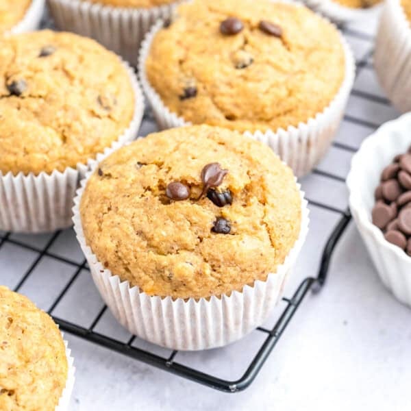 Baked muffins over a wire rack.