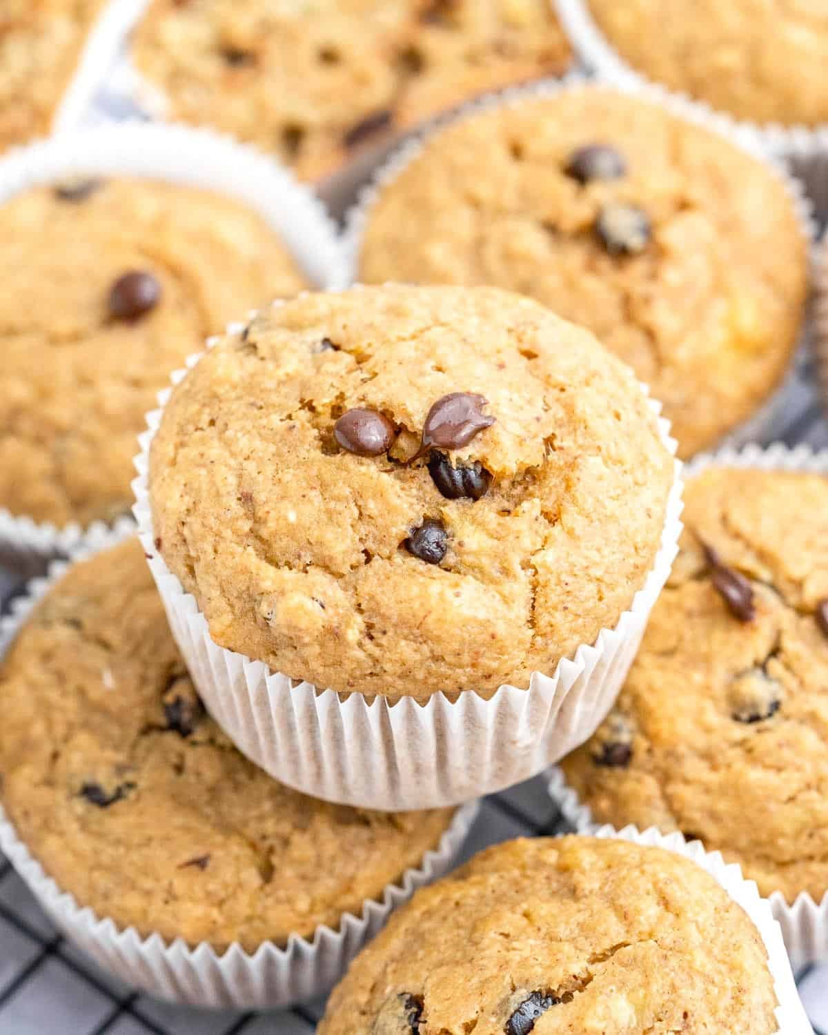 Muffins stacked over each other on a plate.