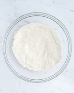 flour mixed in a bowl with baking powder.