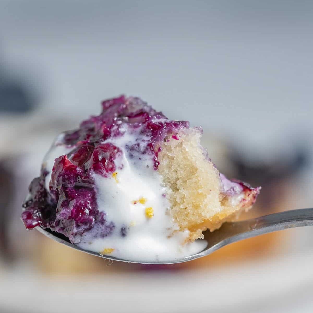 A spoonful of blueberry cobbler.