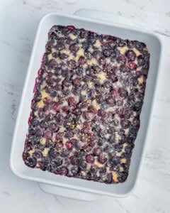 Baked blueberry cobbler in a dish.