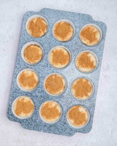 Prepared muffins in a pan to be baked.