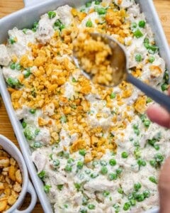 creamy shredded chicken mixture spread over a baking dish and then stopped with crushed ritz crackers.