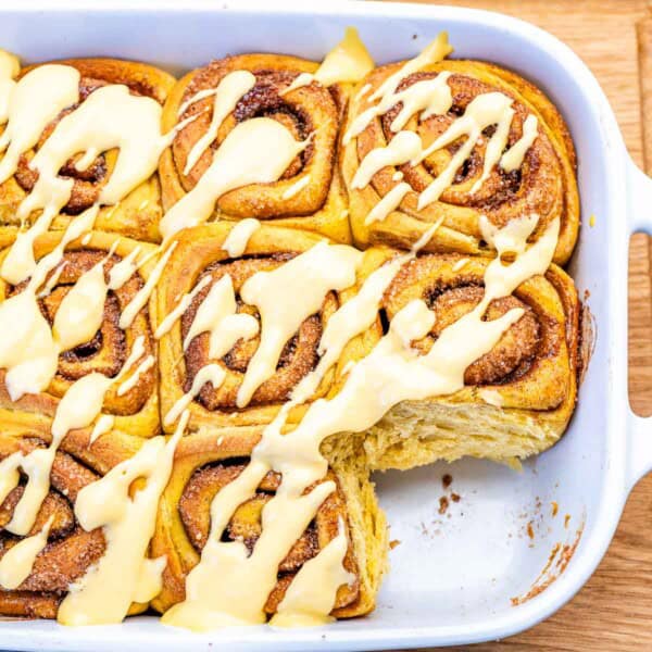Pumpkin cinnamon rolls in a dish.