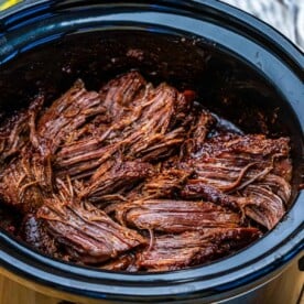 slow cooked chuck roast shredded in a crockpot.