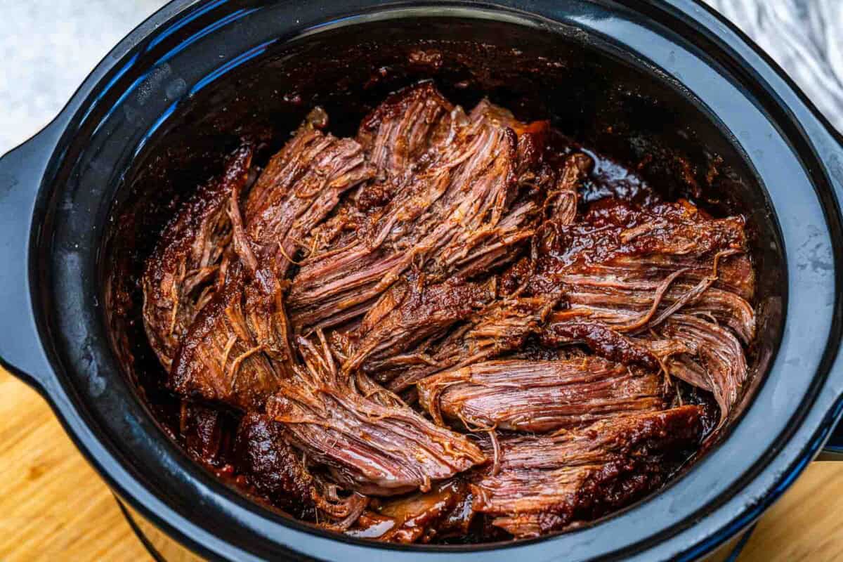 Shredded chuck roast, slow-cooked.