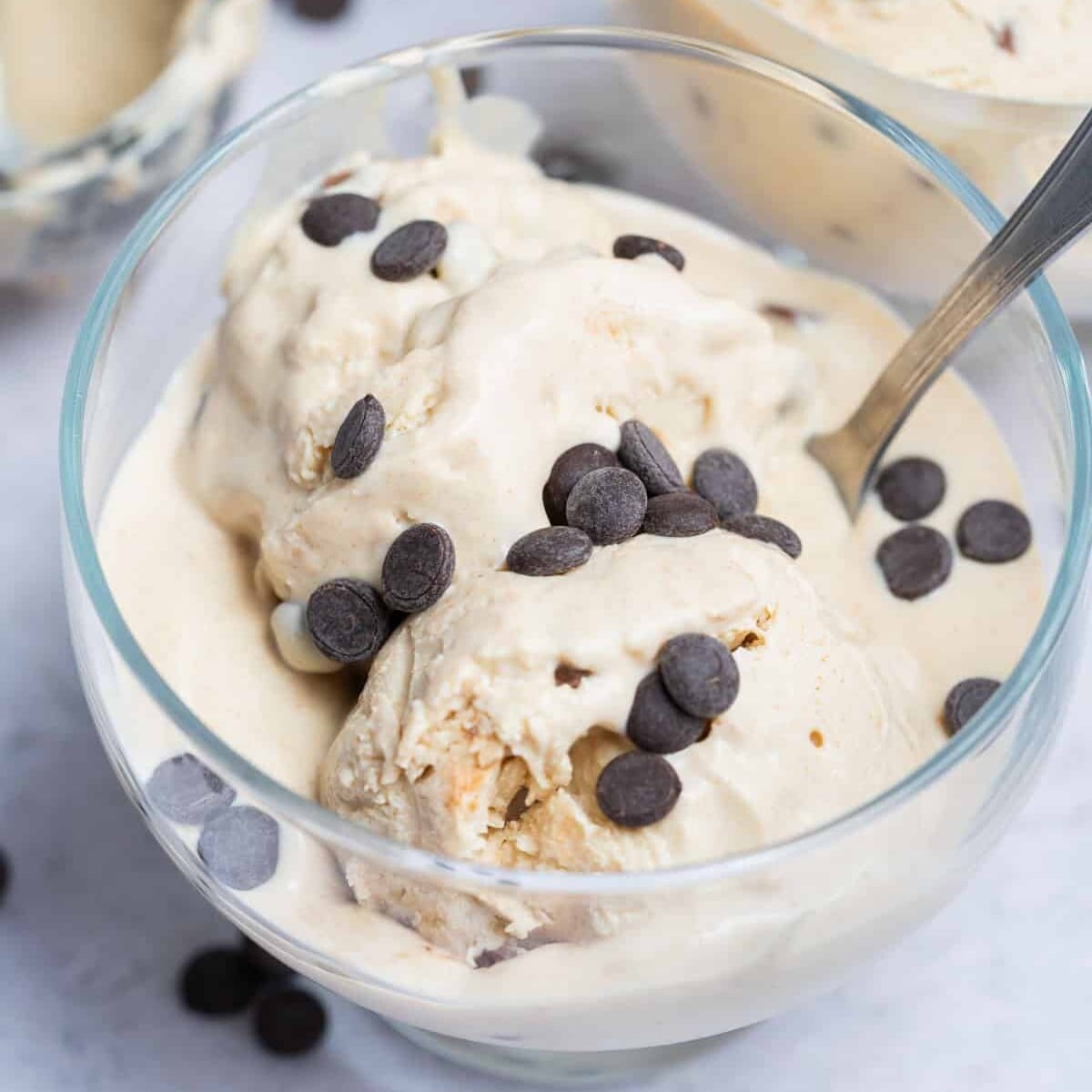Cottage cheese ice cream made with peanut butter and chocolate chips served in a bowl.