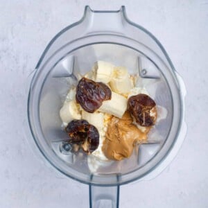 ingredients placed in a blender to make cottage cheese ice cream.