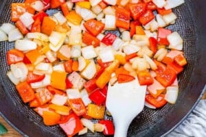 cooking veggies in a pan.