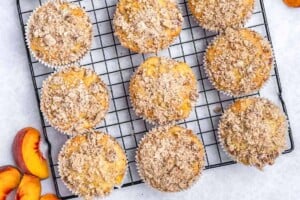 Baked muffins on a wire rack.