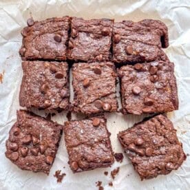 9 brownie squares on parchment paper.