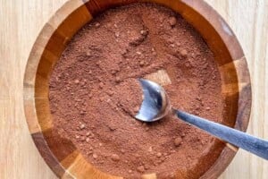 mixing the almond flour, cocoa powder, and baking soda in a bowl.