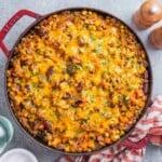 a round casserole pan filled with ground beef and rice casserole.