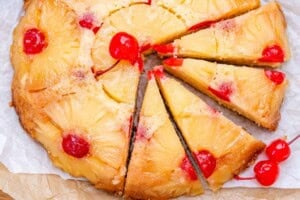 pineapple upside down cake sliced half way.