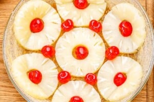 pineapple and cherries placed on the butter pan.