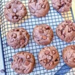Chocolate cookies on a cooling rack.