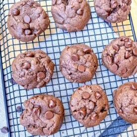 Chocolate cookies on a cooling rack.