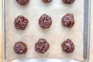 cookies dough bites on a sheet pan to be baked.